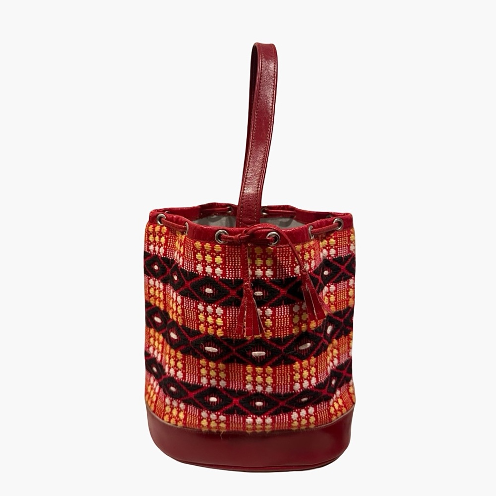 Bold red multi color bag featuring a woven textile design